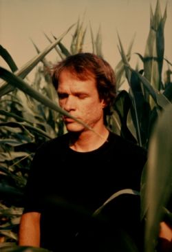 Arthur Russell in an Iowan cornfield, July 1985. Photograph by Charles Arthur Russell, Sr. Courtesy of Audika Records.
