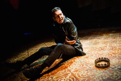 Downward dog: Greg Hicks' Richard is tethered wrist to toe with a jingling chain
