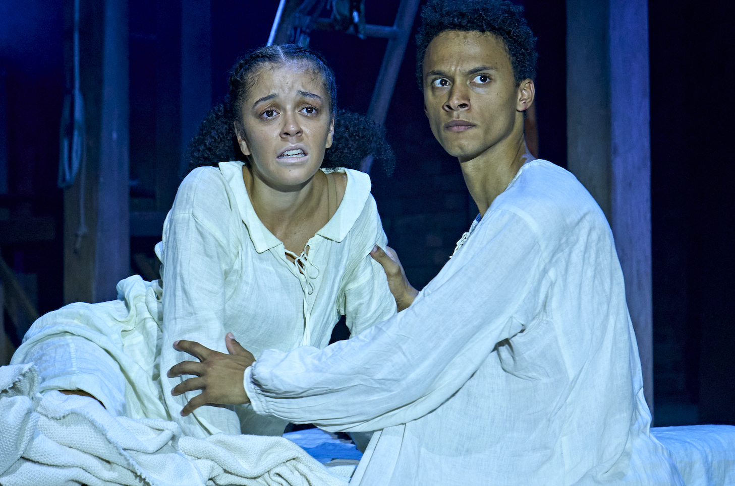 Alex Jarrett as  Judith, Ajani Cabey as Hamnet, in Hamnet