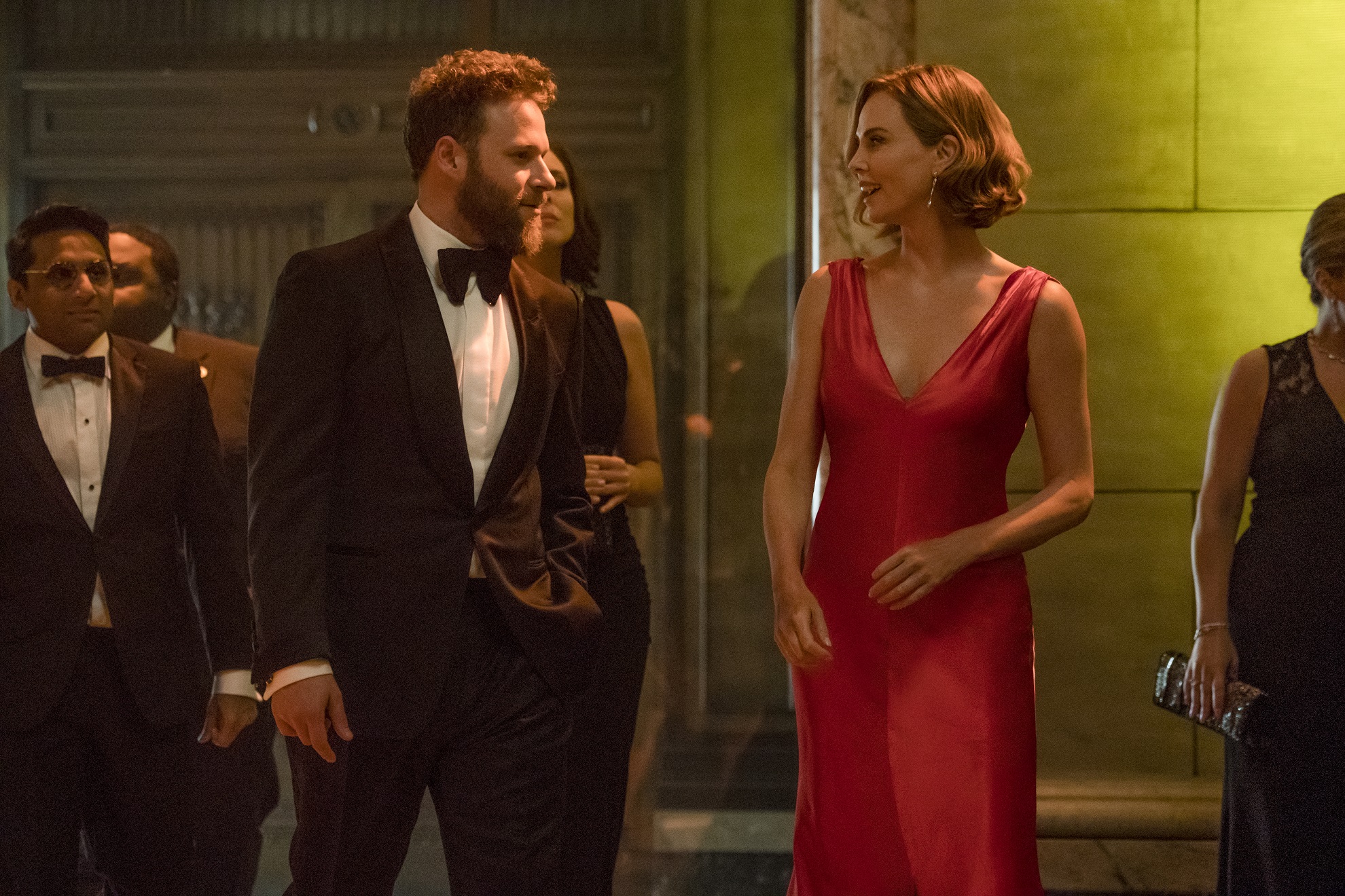 Ravi Patel, Seth Rogen and Charliza Theron in Long Shot