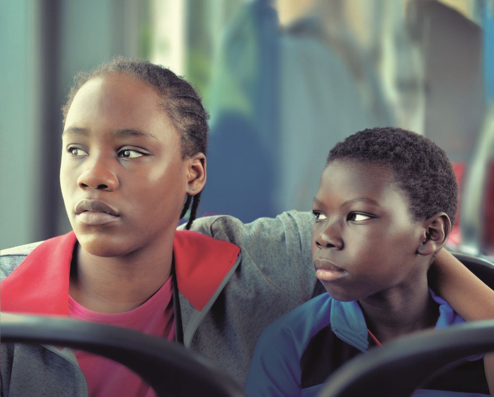 Lokita (Joely Mbundu) and Tori (Pablo Schils) in Tori and Lokita