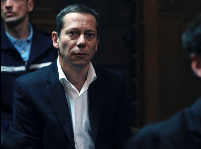 Amalric as Julien in court