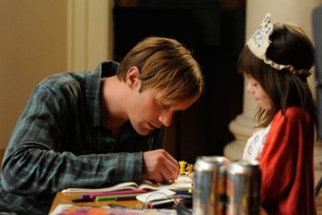 Alexander Skarsgard and Onata Aprile in What Maisie Knew