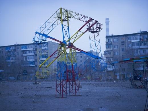 A ferris wheel in Afghanistan: 'Simon Norfolk's colours are heightened, and there is a sense of disquieting stillness'