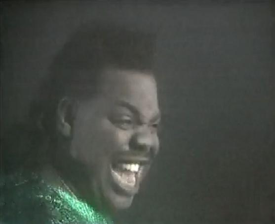 A still from the 'Love Can't Turn Around' video