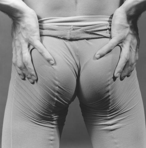 Peter Reed, clenching his buttocks, by Robert Mapplethorpe