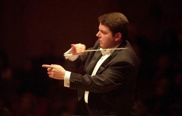 Conductor Andrew Litton: bouncing around like a rubber ball, busily keeping track