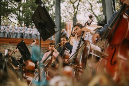 Young Caucasian double-bass players rehearsing Mahler's Second Symphony in the Tsinandali auditorium