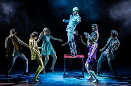 Booted and suited: Dan Baines as Ace Face with the company