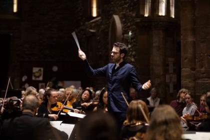 Dinis Sousa conducting the Royal Northern Sinfonia in St Mary's Haddington