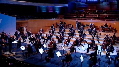 Sir Mark Elder with the socially distanced Hallé Orchestra in the Bridgewater Hall