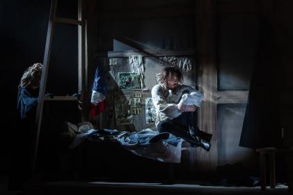 Aaron Cawley as Herman in his barracks room (Act 3 Scene 1)