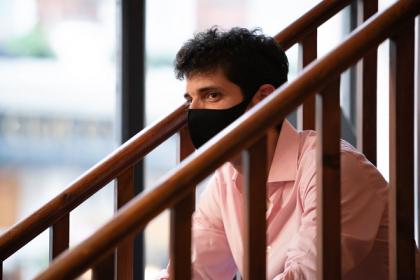 Raffaello Morales on the staircase of the Fidelio Orchestra Cafe listening to a recital
