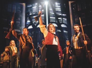 Arise ye workers: Ashley Gilmour and the cast of 'Les Misérables'.