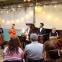 Samson Tsoy (in orange shirt) gives a thanksgiving speech on Sunday evening in the company of John Myerscough, Pavel Kolesnikov, Lawrence Power and Alina Ibragimova
