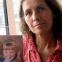 Sylvia holding a photo of her genetic children