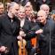 Paavo Järvi extends an elbow to Estonian Festival Orchestra leader Florian Donderer while fellow musicians including Theodor Sink and Triin Ruubel (to left and right of Donderer) look on