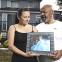 Emma and Tony, with picture of Emma's daughter Xana
