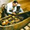 Howard Carter and assistant clean Tutankhamum's gold coffin