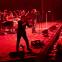 Iggy Pop at the concert's beginning, with trumpet-player Leron Thomas and the band
