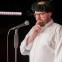 John Kearns explains the purpose of his wig and false teeth