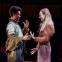 Leah Harvey as Rosalind and Rose Ayling-Ellis as Celia speaking in BSL