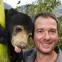 Giles Clark with Mary the sun bear at the Free the Bears sanctuary in Laos