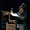 Paterson Joseph as Scrooge in his counting house before the ghostly adventures begin