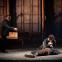Quint (Robert Murray) retreats as the Governess (Verity Wingate) holds Miles