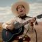 Crooner and gunslinger Buster Scruggs (Tim Blake Nelson)