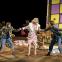 Not-so-sweet 'Rosina Lickspittle' (Alasdair Elliott) entraps Gretel (Susanna Hurrell) and Hansel (Rachel Kelly)