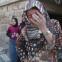 Syria-main-A family reacts in shock as they survey the damage of a government air strike on the Sunni village of Al Barra, 28 October 2012