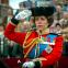 Her Maj (Olivia Colman) takes the salute