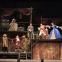Figaro and his clients, battling with the doll's house