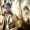 Tom Bateman as John Beecham, with pachyderm