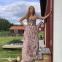 Lyric-soprano star of tomorrow Maja Frydén as Wagner's Freia standing by an entrance to the Vattnäs barn